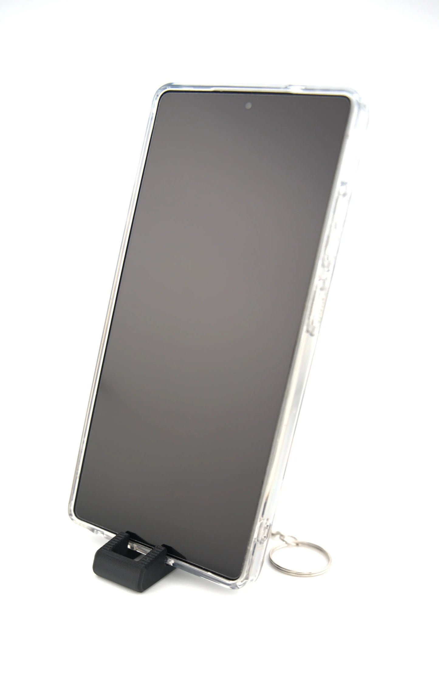 Portable keychain phone stand with whistle close up