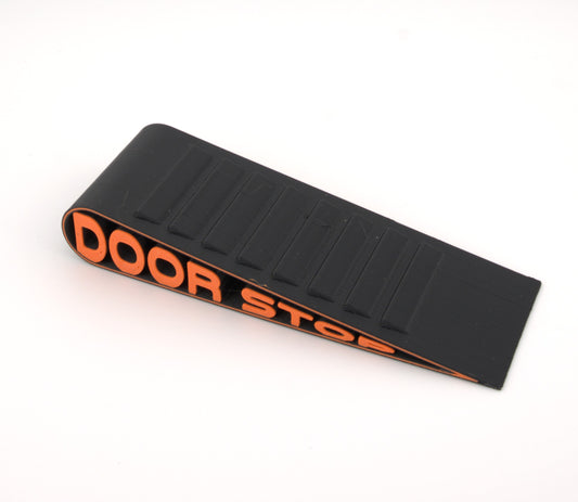 Heavy-Duty Door Stop Wedge – Black with Orange Text – Anti-Slip Design for Commercial, Office, Home, and School Use