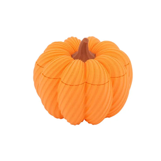 Small orange pumpkin-shaped candy jar with a removable lid