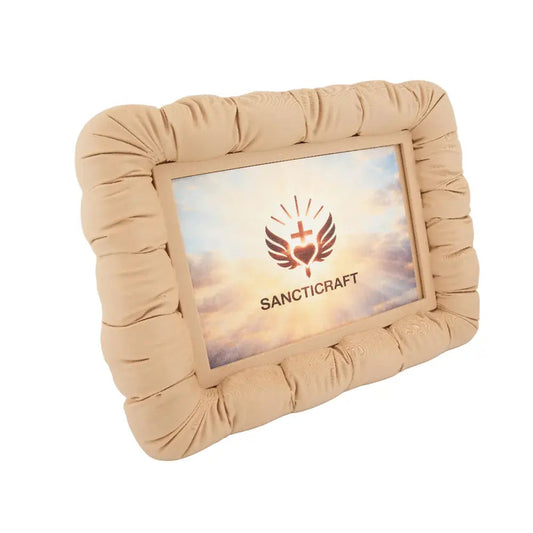 Couch-shaped photo frame holding a small printed photo on a desk