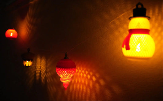 Warm white indoor string lights glowing softly along a shelf