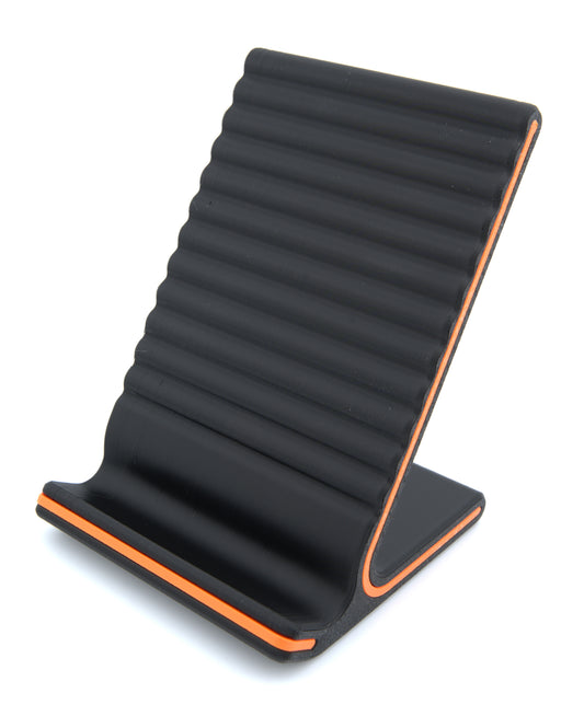 Rolled Phone Stand – Universal Grooved Grip Holder for Smartphones & Mini Tablets – Matte Black with Orange Accent